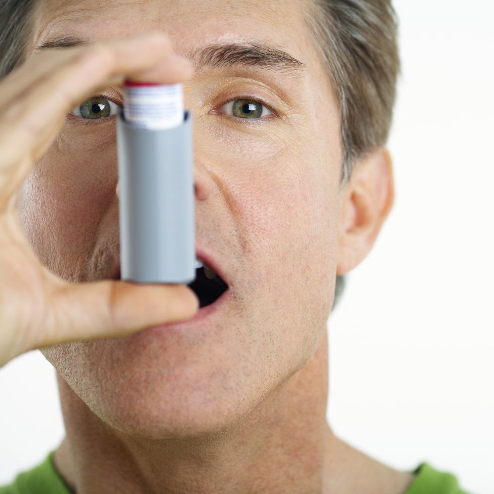 Man breathing from an inhaler